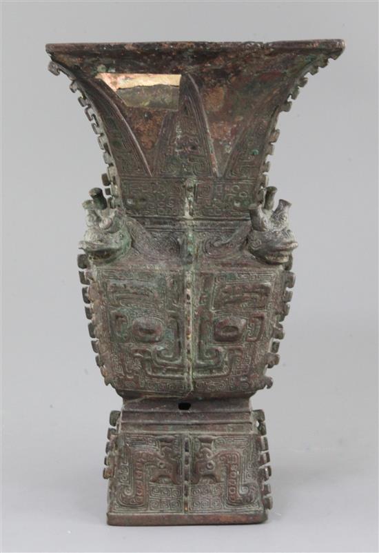 A rare Chinese archaic bronze ritual wine vessel, Fangzun, Shang dynasty, 13th-11th century B.C., 33.5cm high, losses and repairs